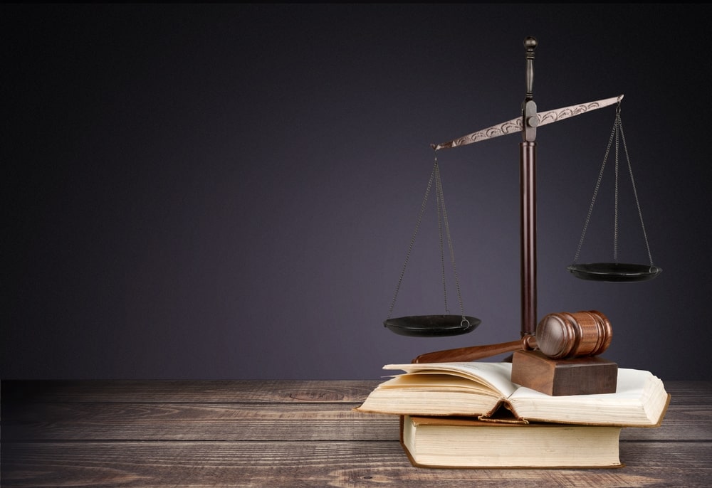 cales of justice, gavel, and law books representing personal injury law in Edison NJ.
