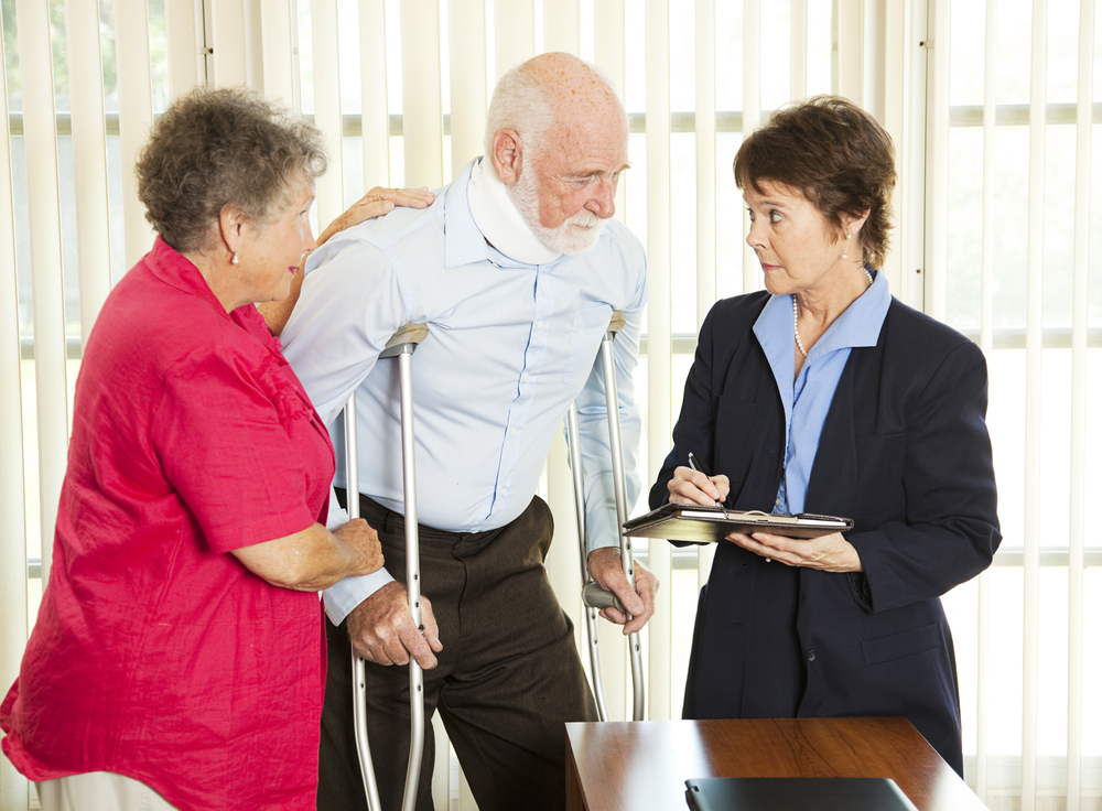  An elderly couple is meeting with a personal injury lawyer to discuss their case. The lawyer has a proven track record of success and is experienced in handling personal injury cases.