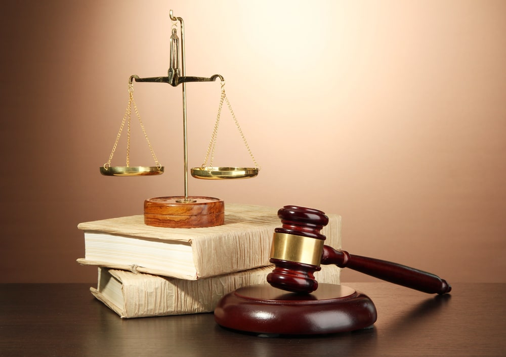 Scales of justice and judge’s gavel on law books, symbolizing personal injury law in South Orange NJ.
