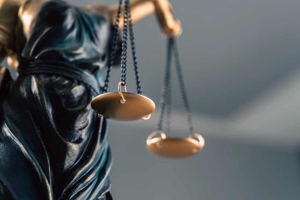 Close-up of Lady Justice holding balanced scales for personal injury legal representation in Union Township, NJ
